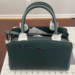 Brand new Coach Mini Lillie in dark forest green.